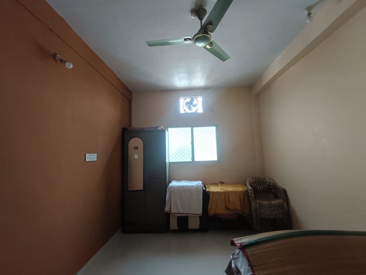 The room as found, looking towards the storage wall
